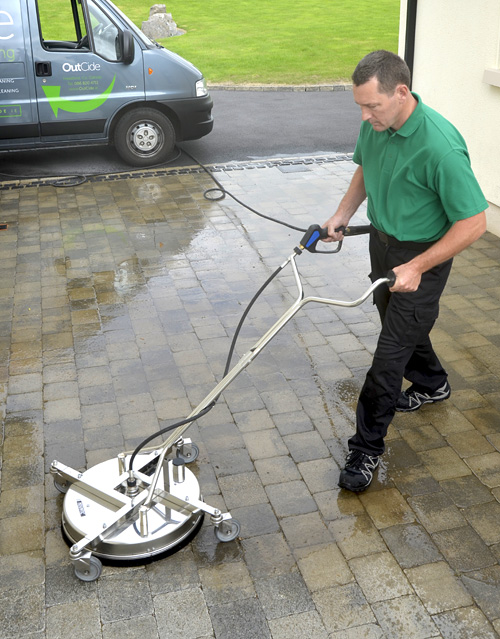 Cleaning block paving with OutCide's Mosmatic surface cleaner.